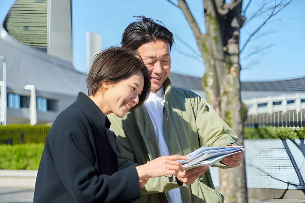Couple looking at itinerary booklet in japan