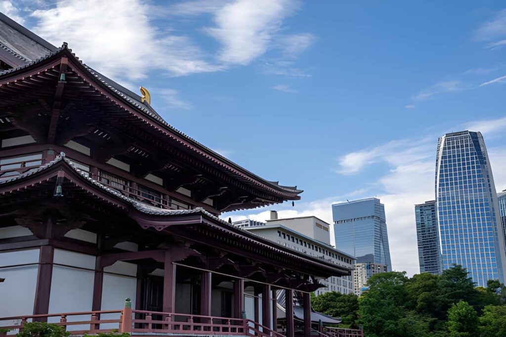 Traditional Japanese temple alongside modern city architecture